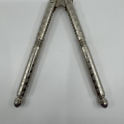 Vintage HMQ nutcracker, a tool designed for cracking nuts.